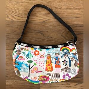 Lesportsac Onolicious Hawaii print handbag w/ rainbow, ocean, palm tree print